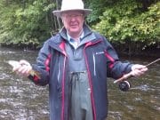 Marvellous enthusiasm not dampened by blustery showers on the Liffey Derek with a little Brown trout from the River Liffey