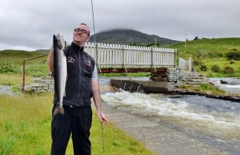 Long-awaited rain gives Inagh a boost just in time for grilse run Lough Inagh Lodge bar manager Thomas Moran with his first ever salmon, a lovely grilse of 6lbs taken at the Derryclare Butts on a Green Highlander