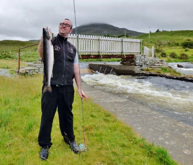 Lough Inagh Lodge bar manager Thomas Moran with his first ever salmon, a lovely grilse of 6lbs taken at the Derryclare Butts on a Green Highlander