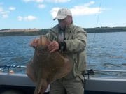 The whole family goes fishing onboard the John Boy with great craic Paul with his 12lb. fish.