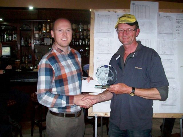 Tony Kersley receives his trophy from Patrick McCarville, Creighton Hotel