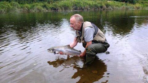 Paul Releases His Second Fish of the Day Back to the Waers of the River Boyne