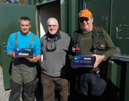 Treasurer Pat Smith presenting the trophy and prizes - Shamye Byrne biggest brown at 47 cm and Michael Sheehan competition organizer biggest rainbow 63 cms