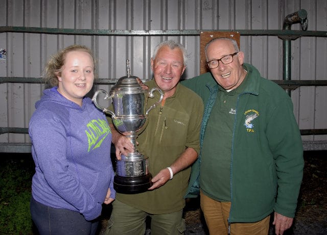 Eleanor Quinn and her Grandad Con Hope present Mick Flanagan with Lough Ennell Perpetual Cup