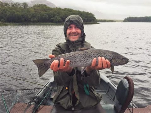 William Hamilton with a fine  sea trout of almost 5lbs from Lough Inagh. As with all sea trout in Connemara the fish was safely returned again after the photograph.