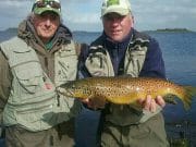 Corrib rounds off a fine season in style Tim Rowley (on left) with guide Larry McCarthy of Corrib View Lodge, holding a fine 3lbs+ trout landed by Tim on L. Corrib. The fish was sportingly released after the photo.
