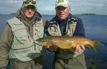 Corrib rounds off a fine season in style Tim Rowley (on left) with guide Larry McCarthy of Corrib View Lodge, holding a fine 3lbs+ trout landed by Tim on L. Corrib. The fish was sportingly released after the photo.