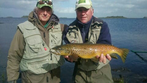 Tim Rowley (on left) with guide Larry McCarthy of Corrib View Lodge, holding a fine 3lbs+ trout landed by Tim on L. Corrib. The fish was sportingly released after the photo.