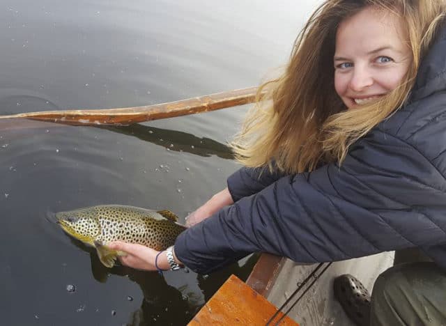 Anna Dawson from Scotland releasing a fine trout caught on a Caenis pattern
