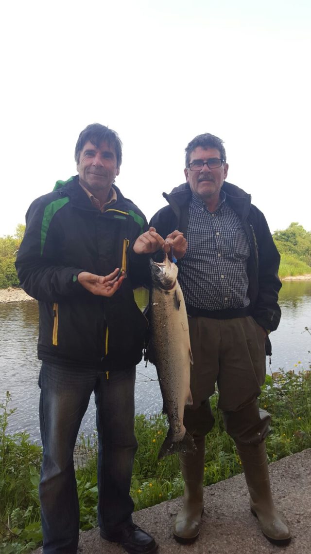 Mickey is seen here in the pic with his brother Benny and showing off his catch and the bait he caught it with.