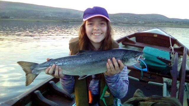 Miss Caitlin McAlister, while fishing with her Granddad, Mr. Jim Sayers, caught a fine 6 lbs. Salmon