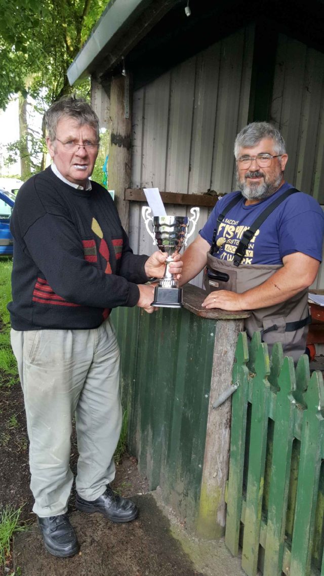 Midlands report - Lene winner Mick Corrigan receives the Paddy Dolan trophy from Pat Brown L.L.A.A Lene winner Mick Corrigan receives the Paddy Dolan trophy from Pat Brown L.L.A.A