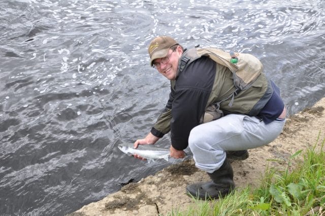 James Allman releases a grilse on the Feale