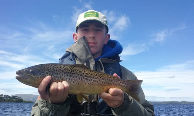 Oisin Reilly from Glencorrib with a fine Corrib trout, one of many he landed on dry fly on a recent day out with dad Frank.