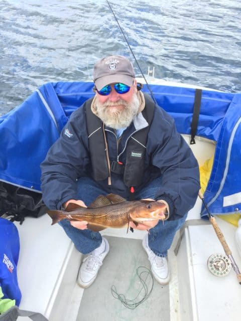 Scott Butler with a nice Kelly cod on the fly