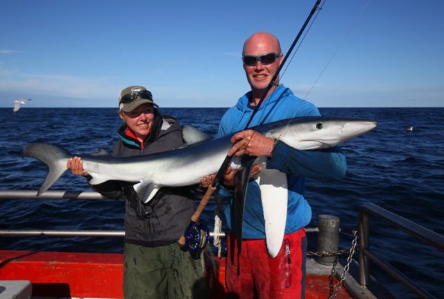 Christin with the biggest of her three shark