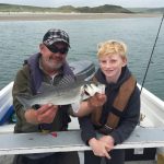 Conall with two of the fifteen bass caught yesterday