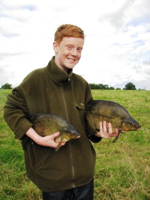 12 year old Conner with a couple cracking Bream, on his first time to Ireland.