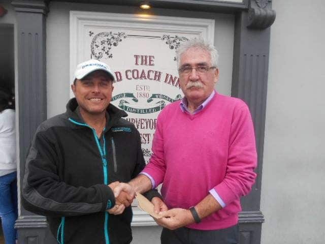 Lee Addy Lee Addy receives his winnings from Dick Caplice