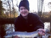 Paul O'Donnell with his cracking trout before he released it back