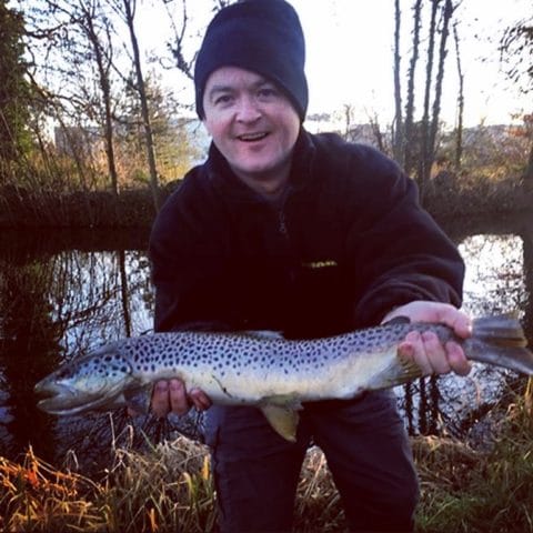 Paul O'Donnell with his cracking trout before he released it back