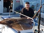 Specimen skate for lucky angler on Clew Bay Angler poses with 210cm skate