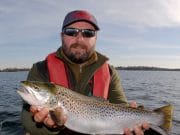 Beautif-Owel trout on troll Angler poses with trout