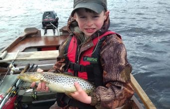 A young angler with his trout