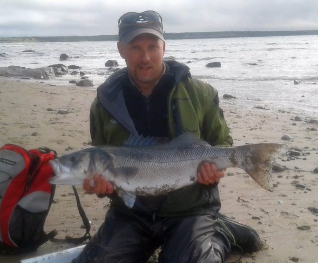 Angler poses with a large bass