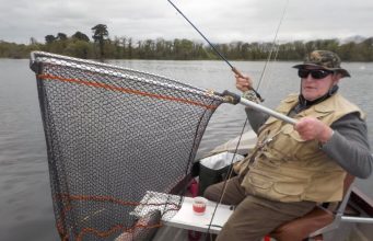 Big hatches and big catches at Carrigavantry Pat Smith club treasure and member of The Irish International Disabled Anglers Team landing a 62 cms rainbow that took a Daiwlbach in a flat calm.