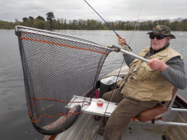 Pat Smith club treasure and member of The Irish International Disabled Anglers Team landing a 62 cms rainbow that took a Daiwlbach in a flat calm.