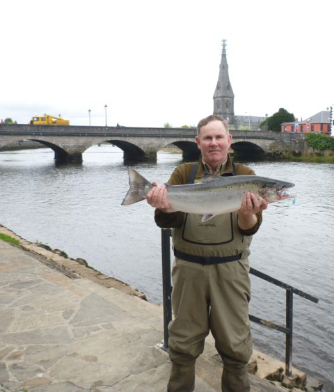 Ridge Pool Ghillie John Howley.with a 13 lb salmon which he caught today on the fly