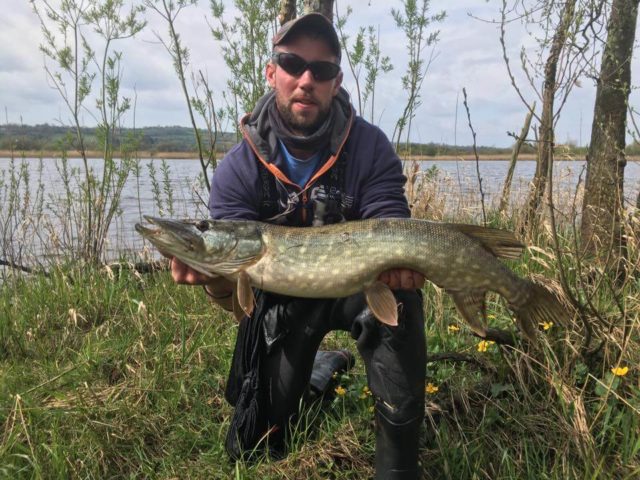 angler with a pike