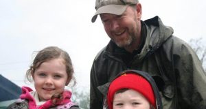 The Duff Family learning about aquatic insect life.