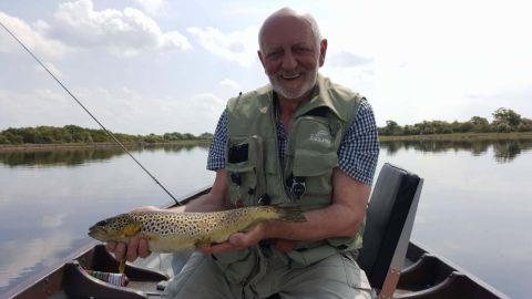 Fishing guide Ted Wherry with a fine Corrib trout caught in flat calm conditions
