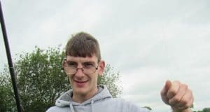 A novice angler from the Central Remedial Clinic enjoys a successful fishing trip with the Dublin Angling Initiative