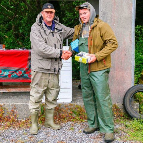 Caolan McDonnell on right hand side of picture being presented with his prizes by John Fahy Cong AC