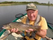 Mount Dalton trout moving well to wet flies Mick with a trout