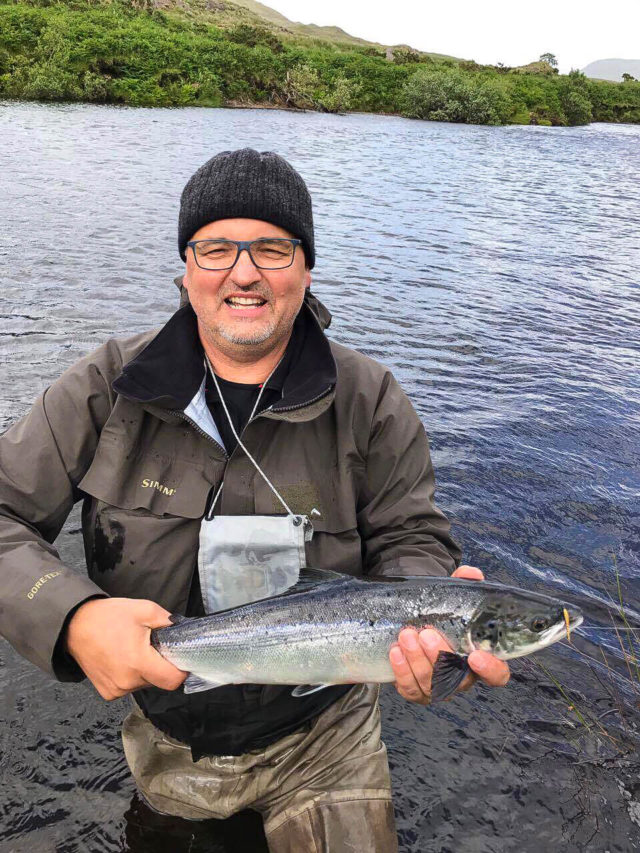 Thomas Merkel getting a quick photo before releasing a wild salmon caught on Beat 6
