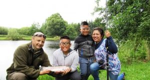 Oisin Cahill of the Dublin Angling Initiative with Darcy Davila (Age 10), Darren Davila (Age 8) and Doreen Davila.