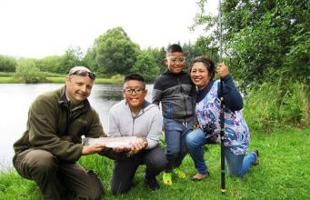 Oisin Cahill of the Dublin Angling Initiative with Darcy Davila (Age 10), Darren Davila (Age 8) and Doreen Davila.