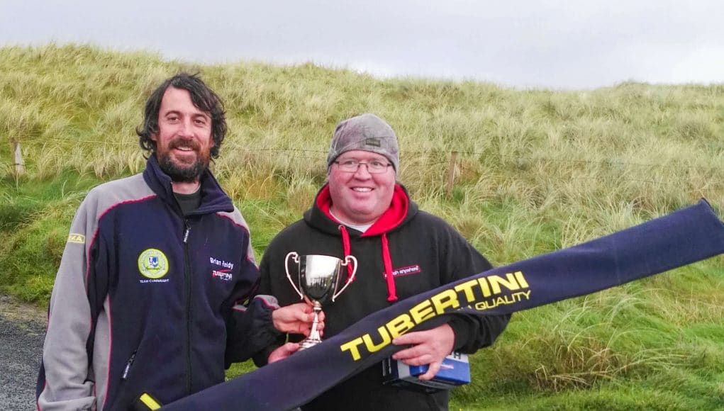 Brian Reidy (left) presents Aidan O'Halloran with the trophy and first prize for winning the Tubertini High Quality West Coast Shore League