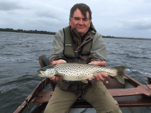 Stuart Topp, The Orkney Islands with his 54cm trout (www.loughsheelinguiding.com)