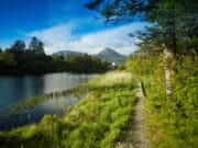 Irish Angling Update – 04 September 2020 River with castle hotel and mountains in background
