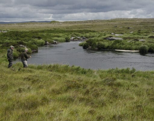 Grilse and sea trout running in Costello & Fermoyle Anglers on river set in wild bogland scenery with mountains in far distance
