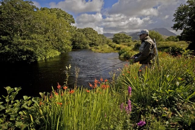 Angler fishing on the riverbank