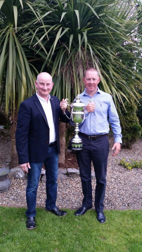 Sponsor Tommy Tuck presents the International Mayfly Competition trophy to top rod Kevin Molloy