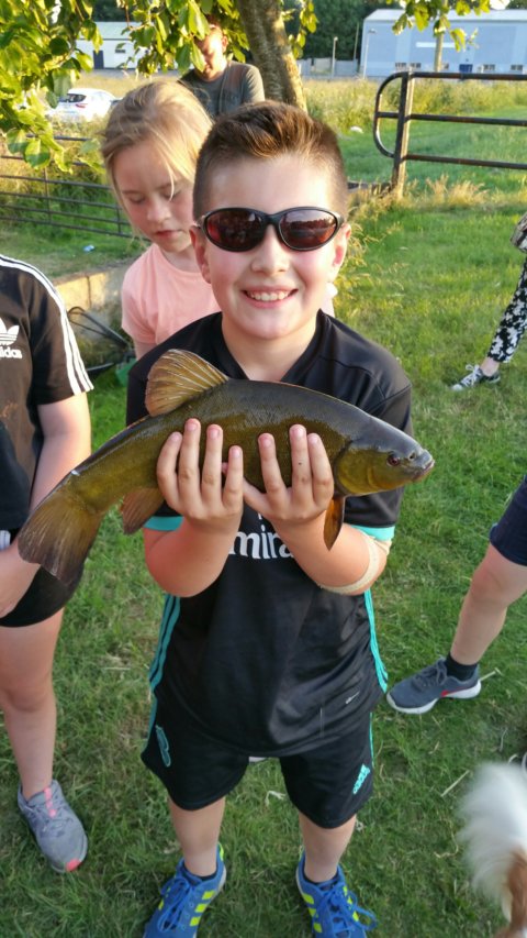 Oisin Carroll with one of his fish a  2lb 4.5oz tench . 