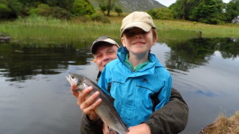 A proud Donal Spellacy with dad Neil and his first salmon