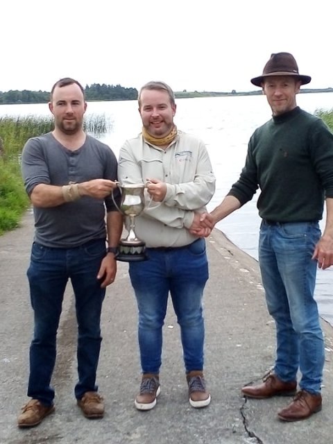 L/R Derek Madden club sec, Ronan Baggott winner receiving the McCarthy cup(2019), Michael McDermott Treasurer.